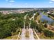 Aerial view of Bellalago's community entrance, roads and the surrounding lakes and lush landscaping at 2901 Agostino Ter, Kissimmee, FL 34746