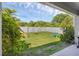 Spacious backyard features green grass, white fence and playground equipment at 2901 Agostino Ter, Kissimmee, FL 34746
