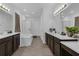 Large bathroom featuring double sinks, tile flooring, a soaking tub, and a glass-enclosed shower at 2901 Agostino Ter, Kissimmee, FL 34746