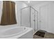 Bathroom with soaking tub and glass enclosed shower at 2901 Agostino Ter, Kissimmee, FL 34746