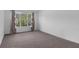 Bright bedroom featuring a large window with natural light and neutral carpet at 2901 Agostino Ter, Kissimmee, FL 34746