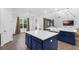 Bright, modern kitchen featuring dual islands, a farm sink, and ample counter space for cooking at 2901 Agostino Ter, Kissimmee, FL 34746