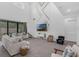 Open living room features high ceilings, modern wall decor, comfortable seating, and large sliding glass door at 2901 Agostino Ter, Kissimmee, FL 34746