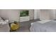 Carpeted bedroom featuring a TV, sitting area with plush chairs and a king bed at 2901 Agostino Ter, Kissimmee, FL 34746