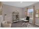 Cozy home office with natural light, neutral paint, modern desk, and comfortable seating at 2901 Agostino Ter, Kissimmee, FL 34746