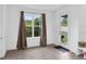 Bright sun room with tile floor, large window, and door leading to the backyard at 2901 Agostino Ter, Kissimmee, FL 34746