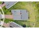 Aerial perspective of a home showcasing the roof, surrounding greenery, and brick-paved driveway at 2914 Scarlett Dr, St Cloud, FL 34772