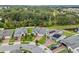 Aerial view of a single-Gathering home with a brick driveway, green lawn, and neighborhood landscape at 2914 Scarlett Dr, St Cloud, FL 34772