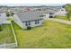 Aerial shot of a backyard featuring a well-maintained lawn and fenced perimeter at 2914 Scarlett Dr, St Cloud, FL 34772