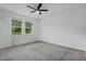 A spacious bedroom featuring large windows and a ceiling fan at 2914 Scarlett Dr, St Cloud, FL 34772