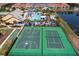 Aerial view of community amenities including a pool, basketball court, tennis court, and community buildings at 2928 Buccaneer Palm Rd, Kissimmee, FL 34747