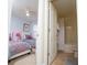 Ensuite bathroom adjacent to a bedroom, featuring a shower-tub combo at 2928 Buccaneer Palm Rd, Kissimmee, FL 34747