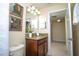Stylish bathroom showcasing a shower-tub combo and a vanity with a granite countertop at 2928 Buccaneer Palm Rd, Kissimmee, FL 34747