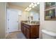 Bathroom with a granite countertop vanity and lots of lights at 2928 Buccaneer Palm Rd, Kissimmee, FL 34747