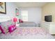 Spacious bedroom with two beds, a white dresser, and a television at 2928 Buccaneer Palm Rd, Kissimmee, FL 34747