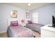 Bright bedroom with two twin beds, decorative pillows, and a ceiling fan at 2928 Buccaneer Palm Rd, Kissimmee, FL 34747