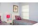 Comfortable bedroom with twin bed, side table with lamp, and window with blinds at 2928 Buccaneer Palm Rd, Kissimmee, FL 34747