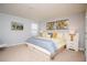 Bright bedroom featuring neutral tones, modern art and platform bed at 2928 Buccaneer Palm Rd, Kissimmee, FL 34747