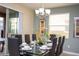 Well-appointed dining area with large windows and modern decor at 2928 Buccaneer Palm Rd, Kissimmee, FL 34747