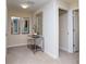 Bright hallway featuring neutral carpeting, modern decor, and access to multiple rooms at 2928 Buccaneer Palm Rd, Kissimmee, FL 34747