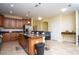 Open kitchen featuring a center island with bar seating and stainless steel appliances at 2928 Buccaneer Palm Rd, Kissimmee, FL 34747