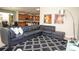 Cozy living space with a sectional sofa, area rug, and contemporary decor at 2928 Buccaneer Palm Rd, Kissimmee, FL 34747