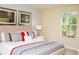 Bright main bedroom featuring a king-sized bed, neutral tones, and natural light at 2928 Buccaneer Palm Rd, Kissimmee, FL 34747