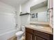 Well-lit bathroom features a shower, vanity, and ample storage in the cabinet at 29746 Anahid Dr, Leesburg, FL 34748