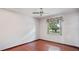 A comfortable bedroom features wood-look flooring, natural light, and neutral accents for a serene ambiance at 316 Cambridge Dr, Longwood, FL 32779