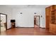 Spacious living room with wood floors and access to multiple rooms in the house at 316 Cambridge Dr, Longwood, FL 32779