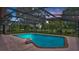 Sparkling pool with screened enclosure and brick trim provides a perfect spot for relaxation and recreation at 316 Cambridge Dr, Longwood, FL 32779