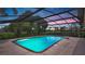 Beautiful pool with screened enclosure and brick trim offers a serene and private sunset views at 316 Cambridge Dr, Longwood, FL 32779
