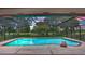 Sparkling pool with screened enclosure and brick trim with sunset view at 316 Cambridge Dr, Longwood, FL 32779
