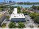 Aerial view of a condo building and parking lot surrounded by trees at 320 Lakeview St # 220, Orlando, FL 32804