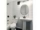 Modern bathroom showcasing ship lap walls, pedestal sink, and black fixtures at 320 Lakeview St # 220, Orlando, FL 32804