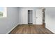 Bedroom featuring wood floors, closet, and white trim at 320 Lakeview St # 220, Orlando, FL 32804