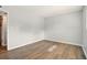 A simple empty bedroom featuring hardwood floors and light neutral walls, providing a blank canvas for your decor at 320 Lakeview St # 220, Orlando, FL 32804