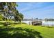 A bench on the grassy lakefront is a great spot to rest and enjoy nature at 320 Lakeview St # 220, Orlando, FL 32804