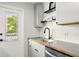A kitchen with stainless steel appliances, white subway tile backsplash, dark hardware, and wood countertops at 320 Lakeview St # 220, Orlando, FL 32804