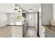 Open kitchen design with light gray cabinets, stainless appliances, wood countertops, and modern lighting fixtures at 320 Lakeview St # 220, Orlando, FL 32804