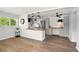 Modern living area with wood floors, a breakfast bar, and stainless steel appliances at 320 Lakeview St # 220, Orlando, FL 32804