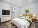 Bright bedroom featuring stylish decor, a window, and a TV for a comfortable and inviting space at 331 Erie Ct, Kissimmee, FL 34759