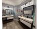 Modern bathroom with double vanity, contemporary mirrors, and plenty of storage space at 3391 S Kirkman Rd # 1236, Orlando, FL 32811
