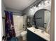 Well-lit bathroom featuring a Harry Potter themed shower curtain and modern vanity at 3391 S Kirkman Rd # 1236, Orlando, FL 32811