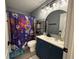 Well-lit bathroom with a modern vanity, stylish mirror, and Harry Potter themed shower curtain at 3391 S Kirkman Rd # 1236, Orlando, FL 32811