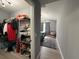View from the closet leading to the bedroom with light grey walls and a gray rug at 3391 S Kirkman Rd # 1236, Orlando, FL 32811
