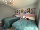 Bright bedroom featuring two beds, stylish lighting, and delightful Mickey Mouse themed artwork at 3391 S Kirkman Rd # 1236, Orlando, FL 32811