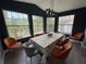 Dining room with a large table, seating for eight, a modern light fixture and natural light from the windows at 3391 S Kirkman Rd # 1236, Orlando, FL 32811