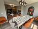 View of the dining room with modern light fixture and seating for six, open to the living room and kitchen at 3391 S Kirkman Rd # 1236, Orlando, FL 32811