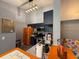 Modern kitchen featuring stainless steel appliances and stylish navy blue cabinets at 3391 S Kirkman Rd # 1236, Orlando, FL 32811
